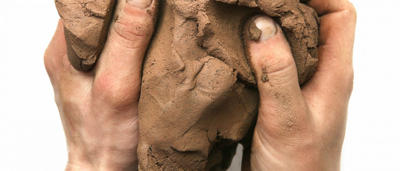 Natural clay piece in hand